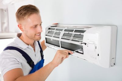 Important-Considerations-for-AC-Installation-and-Update – Copy HVAC technician cleaning and repairing a ductless mini split AC in Springville, UT